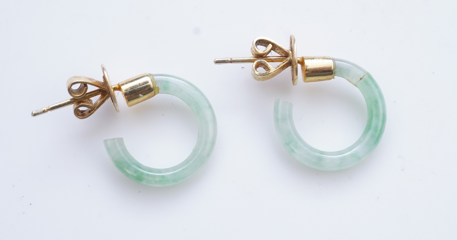 A collection of jadeite jewels, comprising: a bead bracelet with a silver clasp; together with three pairs of studs; one pair of hoop studs, one broken and restuck; and one pair of drop earrings, each set with jadeite, m